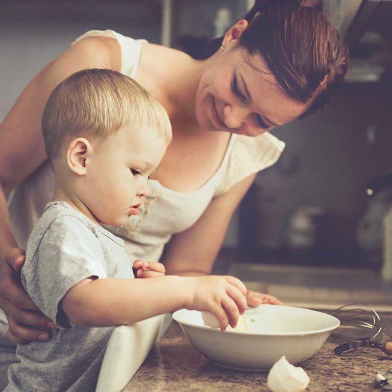 Working in the kitchen is a great developmental tool for your little one
