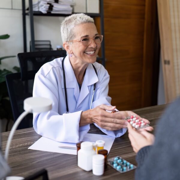 Doctor explaining chronic medication to a patient during a consultation