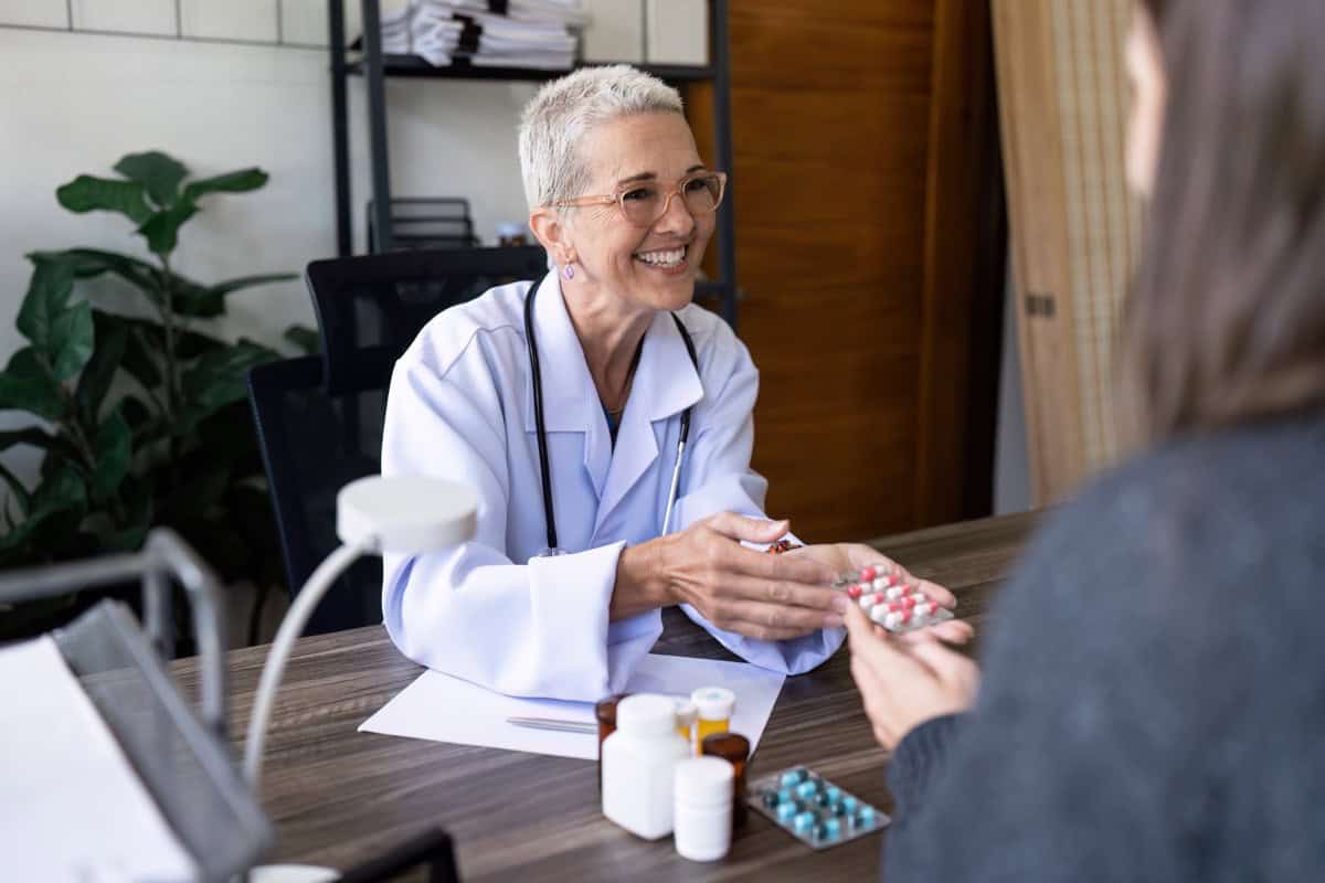 Doctor explaining chronic medication to a patient during a consultation